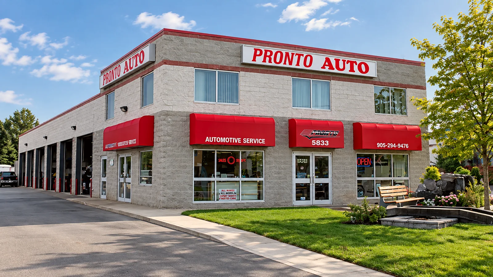 Pronto Automotive shop exterior at 5833 Highway 7 East in Markham, with red awnings and the service bays.